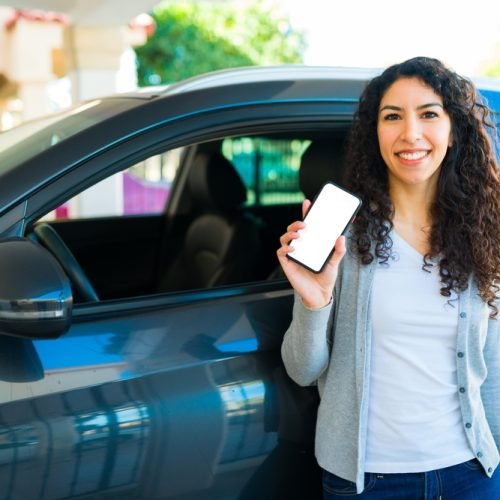 Portrait,Of,A,Happy,Latin,Woman,Using,The,Mobile,App