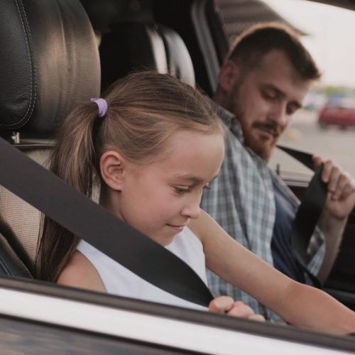 Little,Daughter,Using,Seat,Belt,Near,His,Father,In,The Little,Daughter,Using,Seat,Belt,Near,His,Father,In,The
