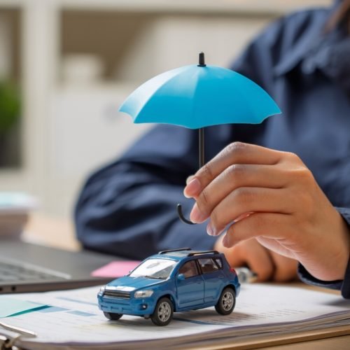 Woman,Hand,Holding,Umbrella,Over,Car,,Symbol,For,Car,Protection,symbolizing Woman,Hand,Holding,Umbrella,Over,Car,,Symbol,For,Car,Protection,symbolizing